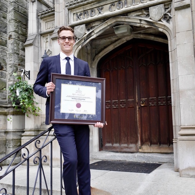 Robert Mackowiak holding his certificate